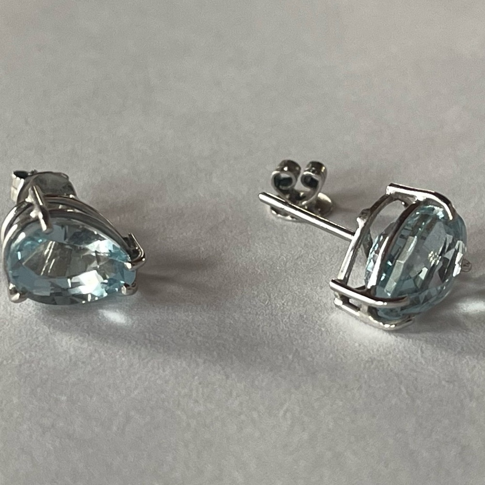 Natural Blue Topaz earrings in white gold.